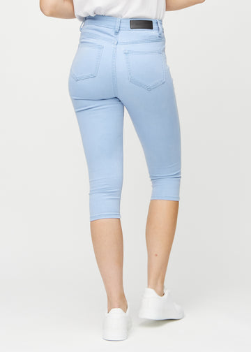 Ljusblå skinny capris sett bakifrån, så att man kan se hela produkten.