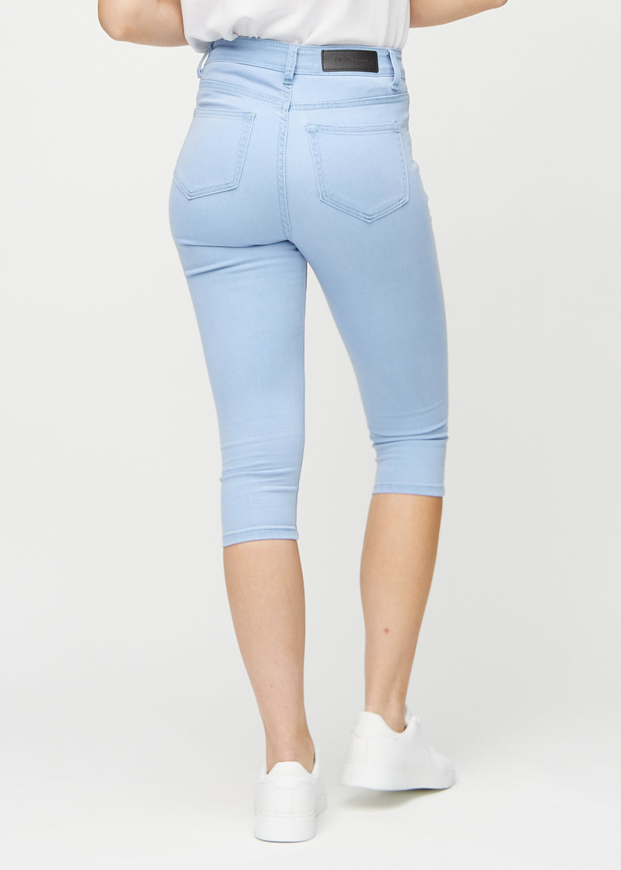 Ljusblå skinny capris sett bakifrån, så att man kan se hela produkten.