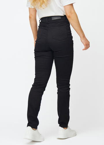 Svarta högmidjade slim jeans sedda bakifrån, så att man kan se hela produkten.
