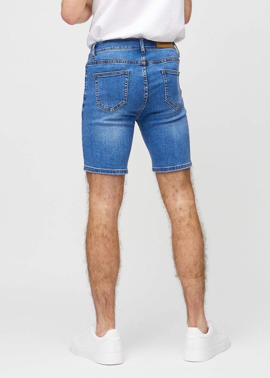 Denim middle-slim shorts set bagfra, så man kan se hele produktet.